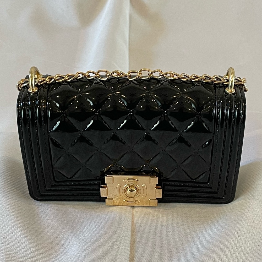Small black jellybean clutch with gold hardware